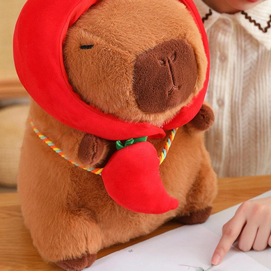 Capybara mit Gemüse-Mütze und Tasche